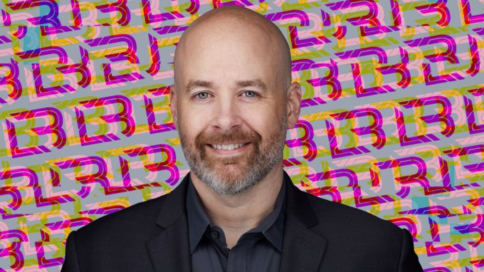 a photo of Jon DiMaggio on a glitchy background featuring LockBit logos.