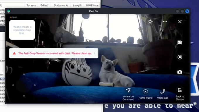 A dog on a couch viewed through the lens of a compromised Ecovacs device.