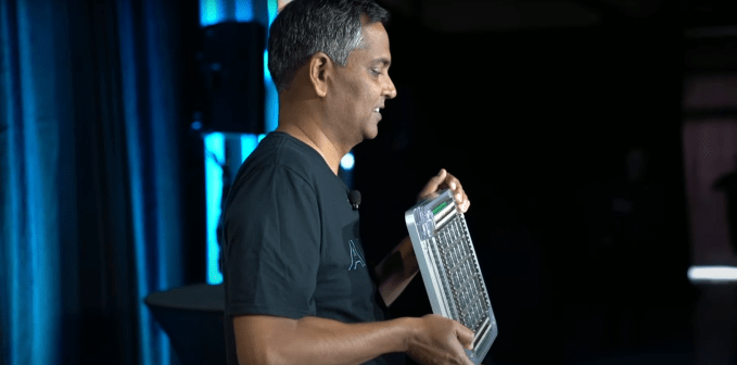Ganesh Venkataramanan, former senior director of Autopilot hardware, showcasing the D1 training tile at Tesla’s 2021 AI Day.