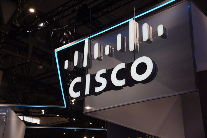 A stock image featuring the Cisco logo at a convention center.