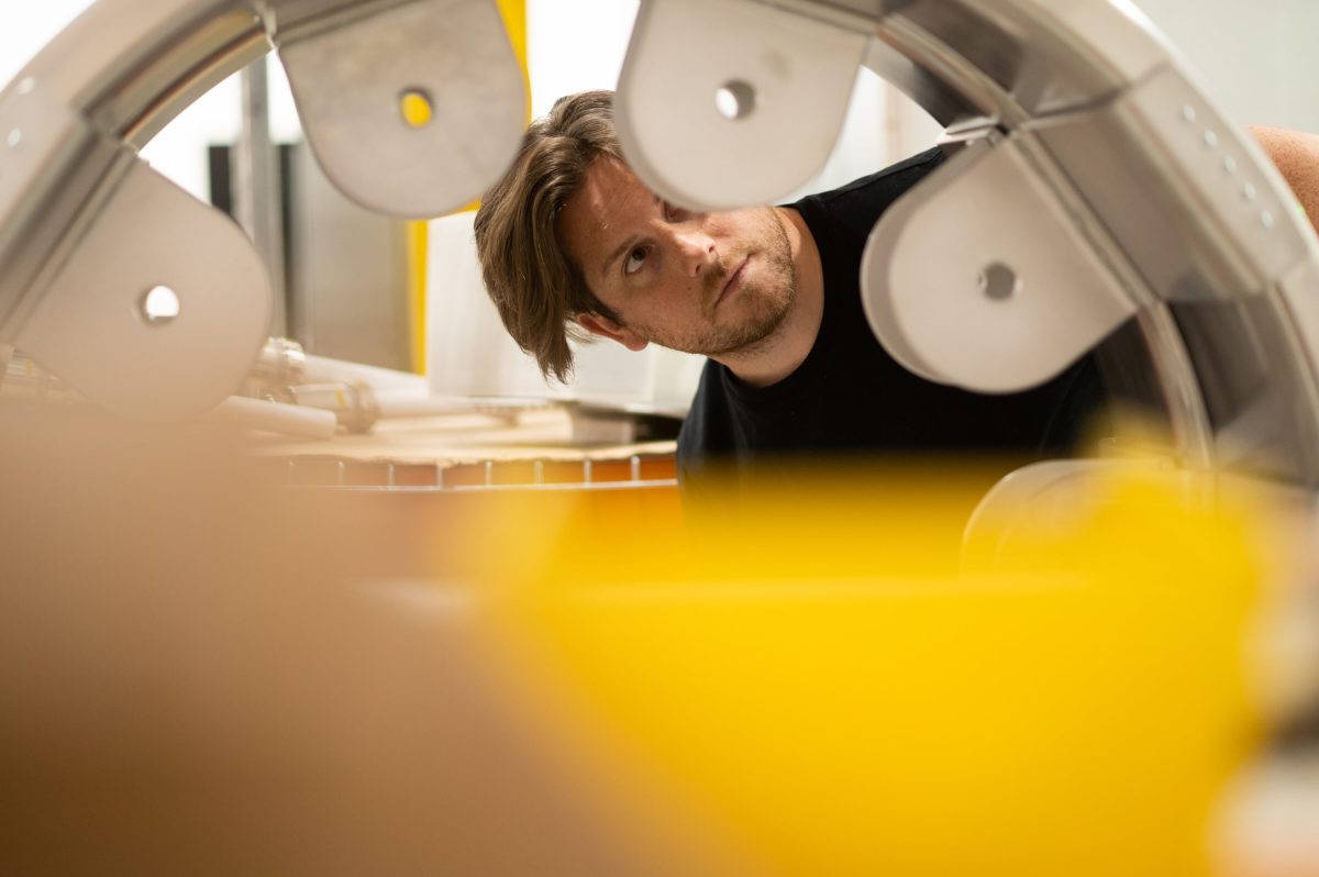 An engineer inspects a stage of Pacific Fusion