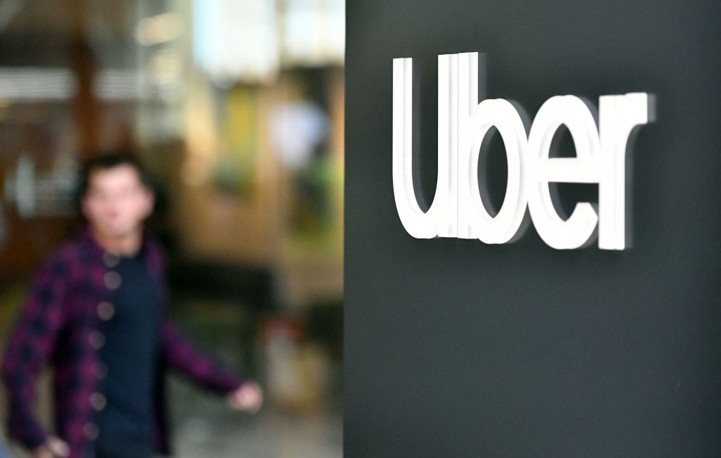 An Uber logo is seen on a sign outside the company
