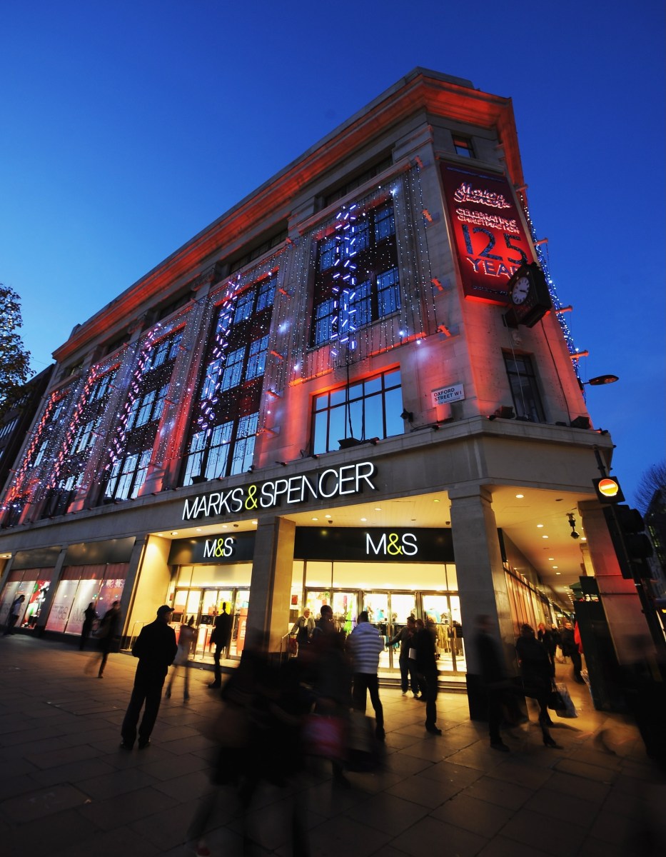 General view of shoppers walking past the entrance to the Marks & Spencer store on Oxford Street on November 26, 2009 in London, England.
