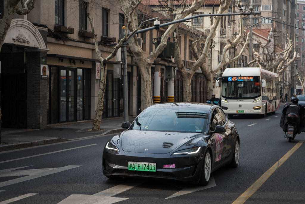 Tesla Model 3 vehicle drives on the street on February 27, 2025 in Shanghai, China.