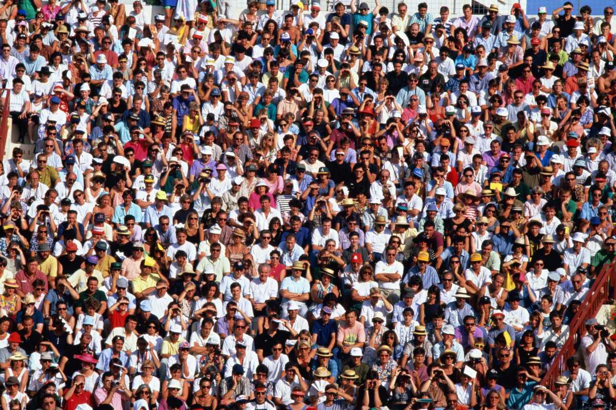 A crowd of people watching a sporting event.