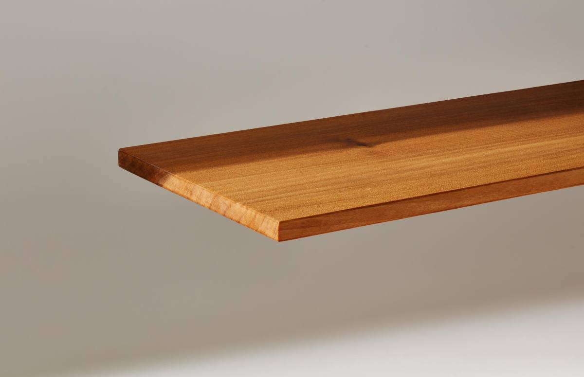 A plank of InventWood Superwood stands against a white background.