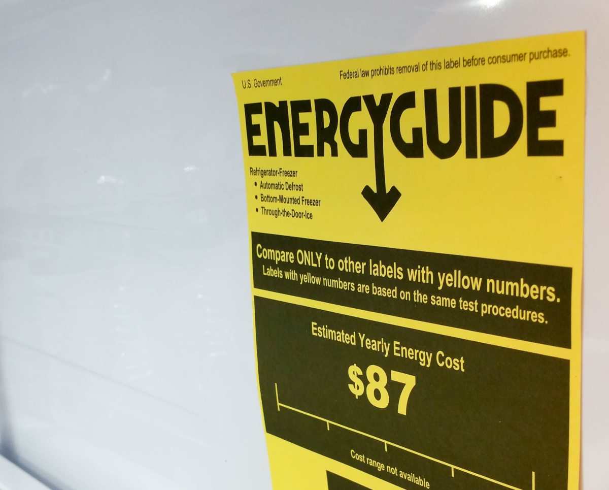A yellow EnergyGuide label displayed inside a refrigerator.