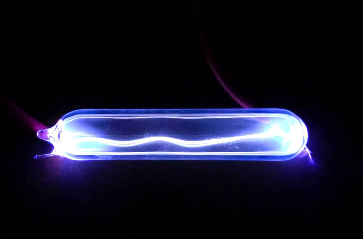 Electricity lights up krypton gas, showing a plasma discharge.