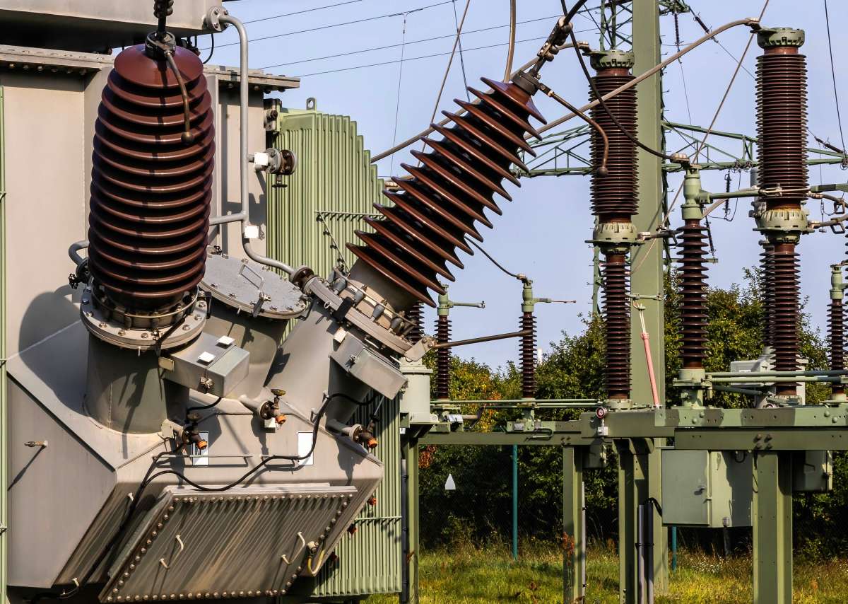 An electrical transformer connects to the grid.