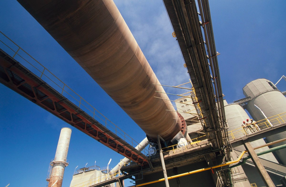 A rotary kiln at a cement plant viewed from below.