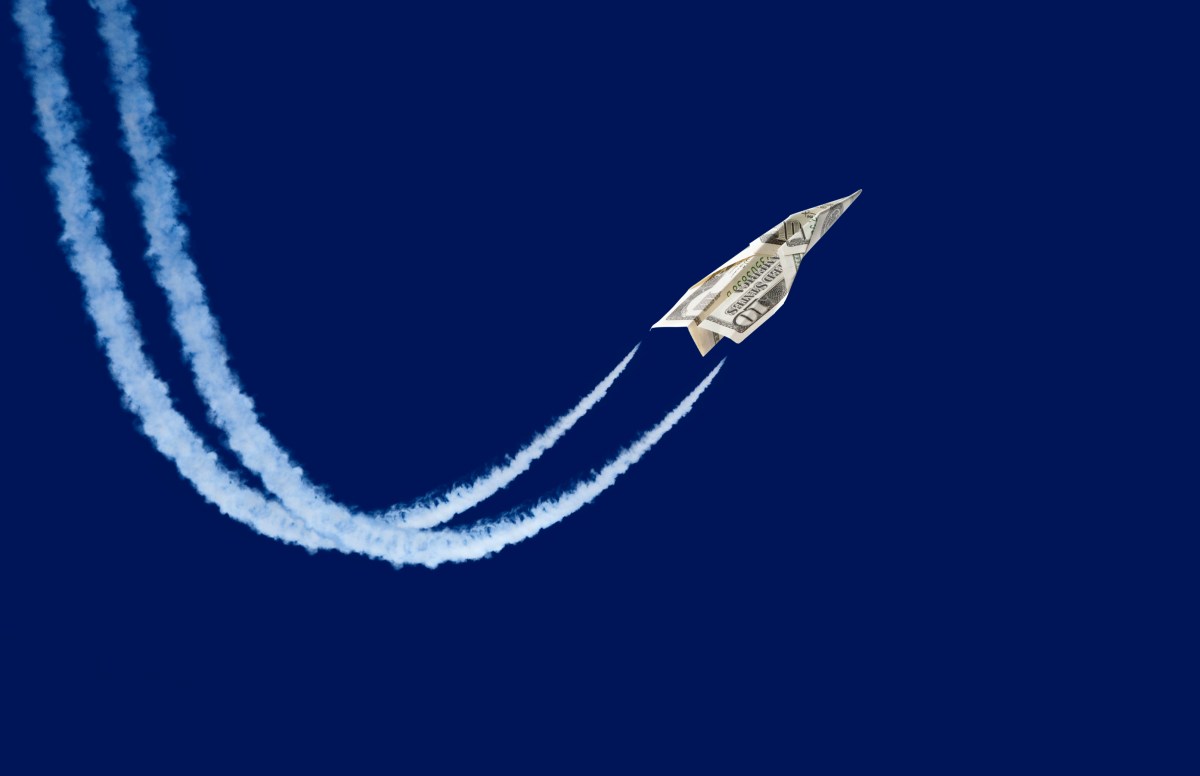 paper plane made from a ten-dollar bill 